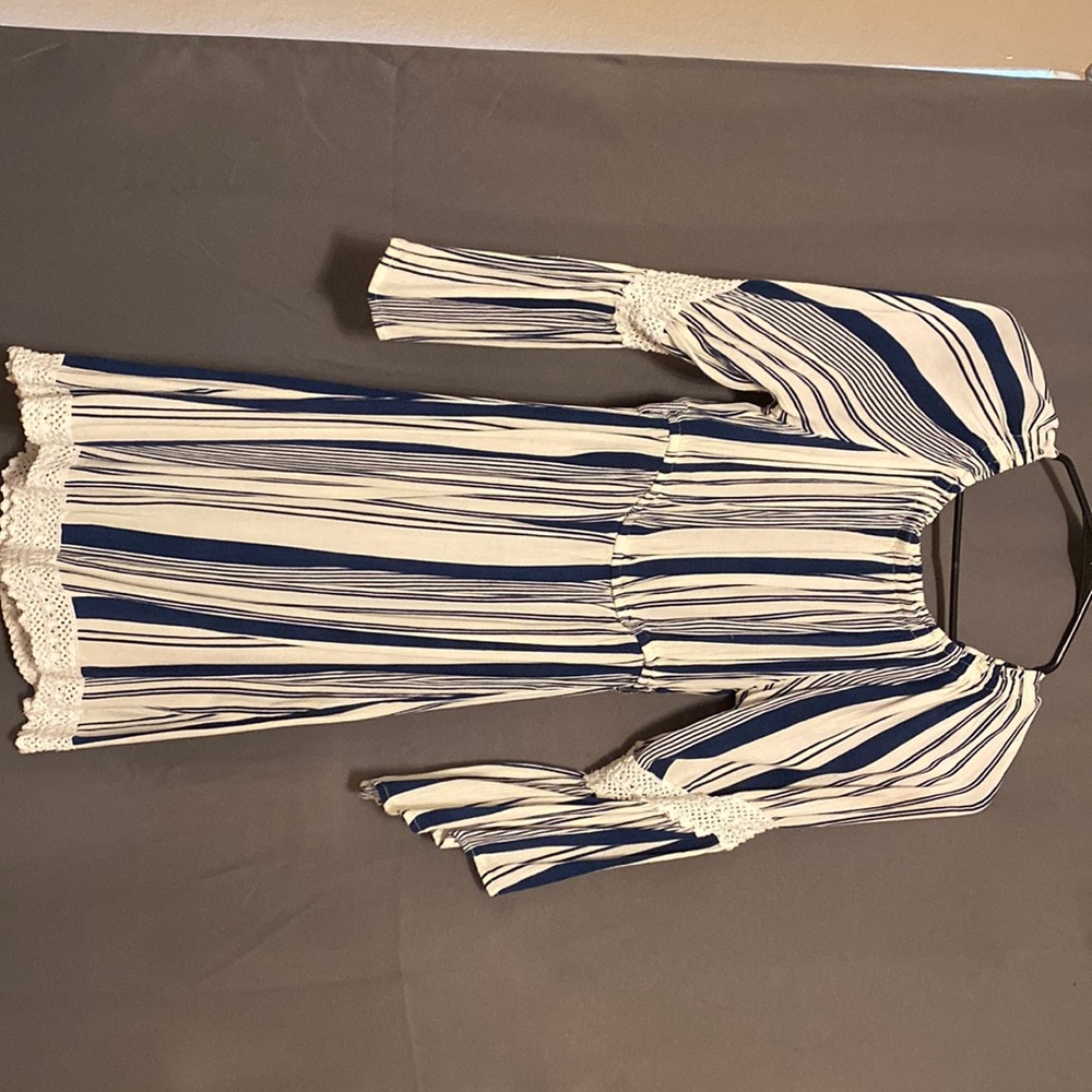 Off the shoulder/ mid length blue and white dress.